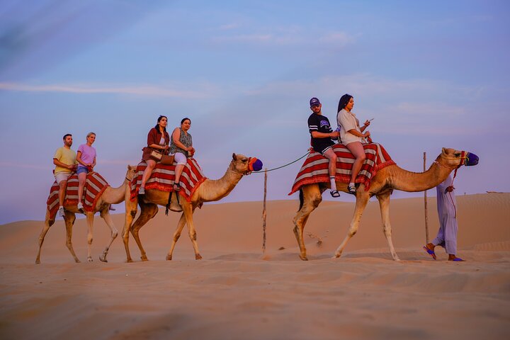 Experience a thrilling Dubai desert safari with dune bashing, quad biking, camel rides, and a BBQ dinner, photo 11 | wizardtrip
