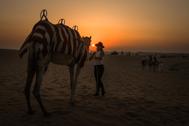 Experience a Dubai desert sunset camel ride with BBQ dinner and traditional camp activities, photo 10 | wizardtrip