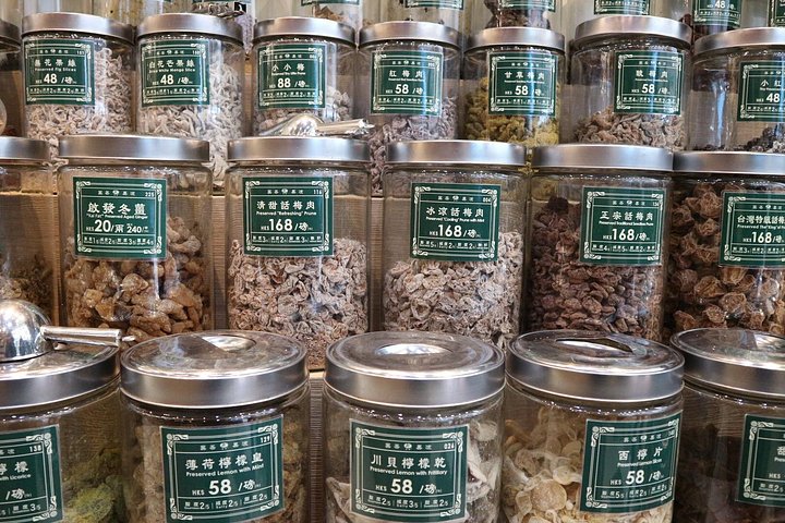 A small group enjoys a culinary tour of Hong Kong Island, tasting local foods and exploring vibrant neighborhoods, photo 8 | wizardtrip