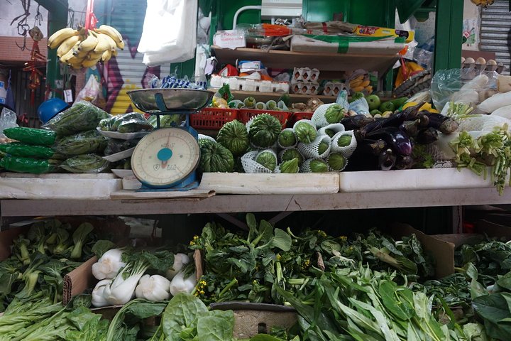 A small group enjoys a culinary tour of Hong Kong Island, tasting local foods and exploring vibrant neighborhoods, photo 9 | wizardtrip