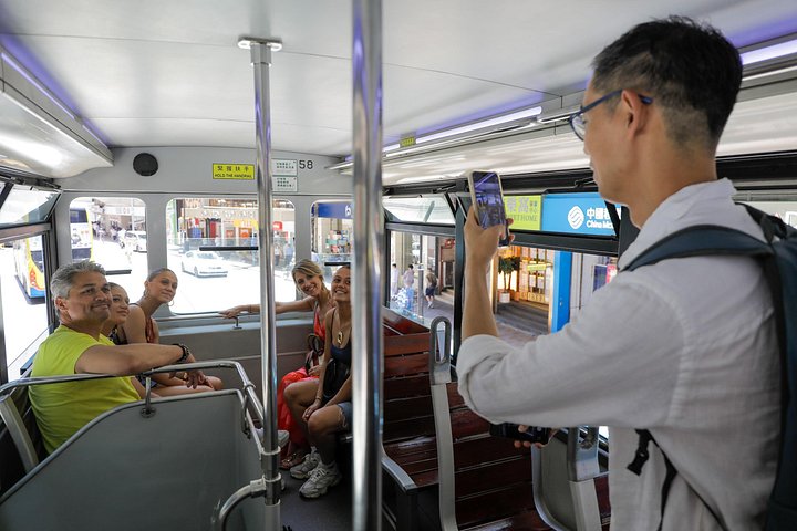 A small group enjoys a culinary tour of Hong Kong Island, tasting local foods and exploring vibrant neighborhoods, photo 14 | wizardtrip